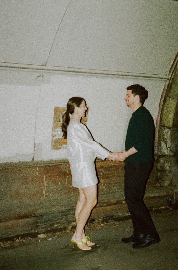 Carley and Chris holding hands
